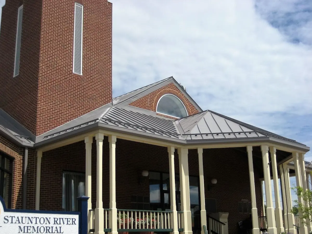 Skilled roofing craftsmen working on a residential roof in Rockford
